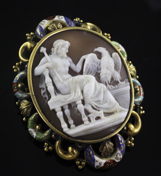 A Victorian gold and polychrome enamel mounted oval cameo brooch carved with Jupiter and eagle, 62mm.